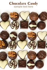 Assortment of chocolate candies from black, milk and white chocolate with nuts and marzipan