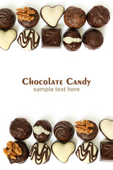Assortment of chocolate candies from black, milk and white chocolate with nuts and marzipan