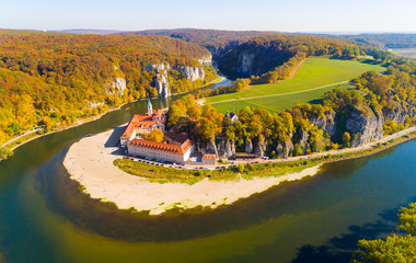 Aerial view to Weltenburg Abbey - Kloster Weltenburg. This landmark is a Benedictine monastery in Weltenburg in Kelheim on the Danube in Bavaria, Germany. - obrazy, fototapety, plakaty