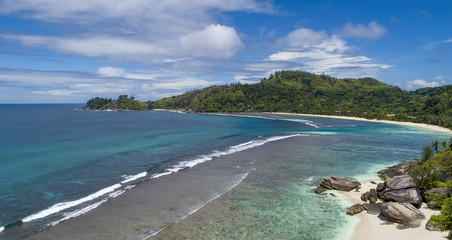 Fototapeta premium Tropical beach with sea and palm taken from drone. Beach and sea photo. Romantic beach aerial view.