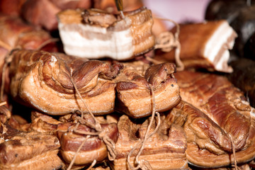 smoked pork meat with ropes. Closeup view
