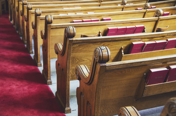 Old wooden church pews. Close-up