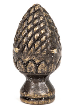 Decorative element in the form of pine cone from bronze, isolated on white background