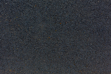 the jet-black asphalt