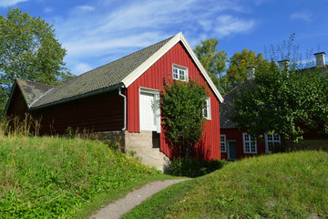 Fototapeta na wymiar Red wooden house, Norsk folkemuseum, Norwegian Museum of Cultural History, Bygdoy, Oslo, Norway