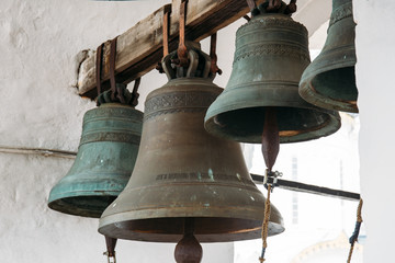 Bronze bells on tower in ancient Kremlin in Rostov the Great, Russia, monument of architecture of famous tourist Golden Ring