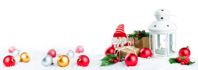 Christmas lantern with gifts, colored balls and Santa Claus on snow isolated background. Christmas background concept