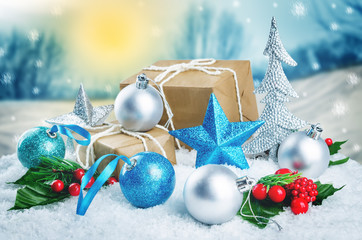Christmas winter background with gifts, colored balls and star