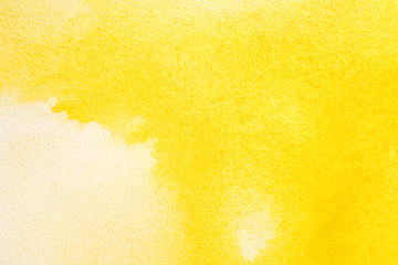 watercolor paper background yellow paint. water spread