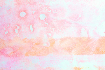 spot of a soft pink watercolor with orange background