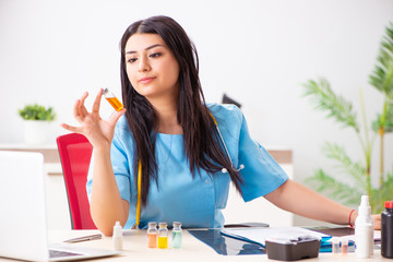 Young beautiful female doctor working in the clinic 