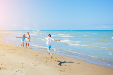 Fototapeta na wymiar Happy family having fun in the summer leisure