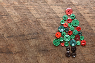 sewing buttons in the shape of a christmas tree