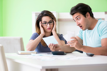 Fototapeta premium Young family struggling with personal finance