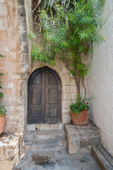 Fototapeta na wymiar Old door in Lindos Town. Greek Island of Rhodes. 