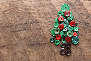sewing buttons in the shape of a christmas tree