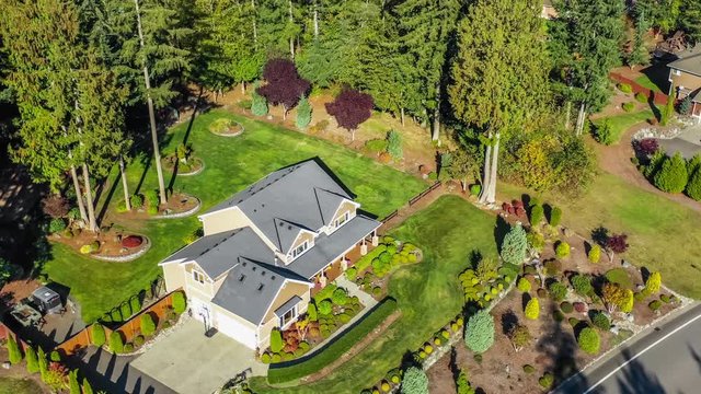 Aerial view of a luxury American craftsman style home; 4k footage circling