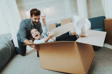 Couple Having Fun During Moving In New Apartment.