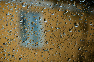 Rain behind a window, adverse weather conditions