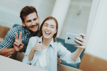 Young Couple Doing Selfie. New Apartment Concept.