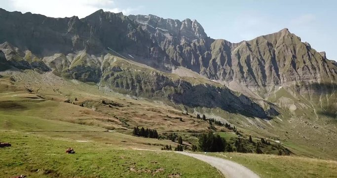 Following a dirt road in the french alps near the col des aravis on a sunny day.