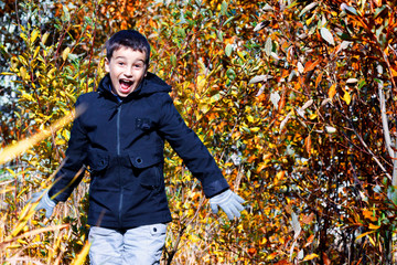 Children's fashion. autumn children's clothing. a boy in a black jacket on a yellow background. informal style. alternative clothing. autumn fashion © justoomm