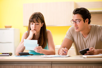Fototapeta premium Young family struggling with personal finance