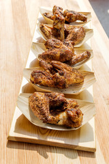 Portion of chicken wings grilled in trays