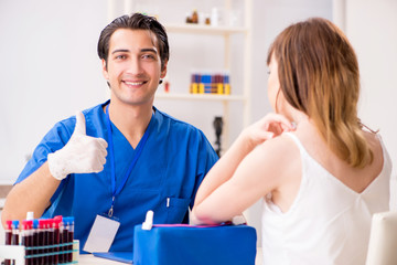 Young patient during blood test sampling procedure
