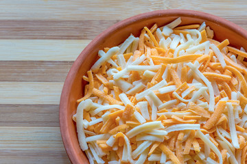 A mix of mozzarella and cheddar cheese