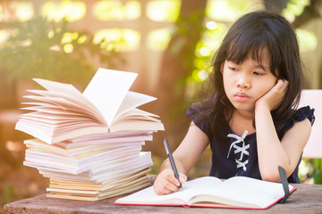 Close up of Portrait Girl drawing outdoor in park.