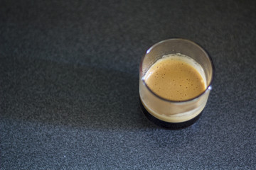Top view of Espresso coffee with foam on a transparent cup