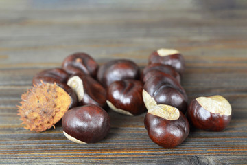 Chestnuts on wooden background