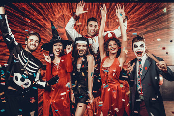 Portrait of Young Smiling People in Scary Costumes