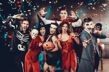 Portrait of Young Smiling People in Scary Costumes