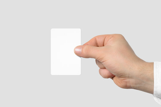 Mockup of male hand holding a Business Card isolated on light grey background. Rounded corner, Europe standard size 85×55 mm.