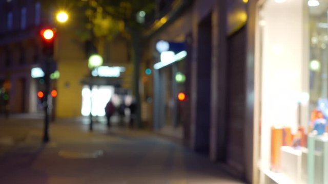 Bokeh street scene with French shops in quiet urban setting