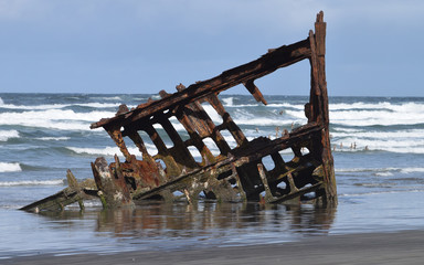 steel ship wreck on the beach