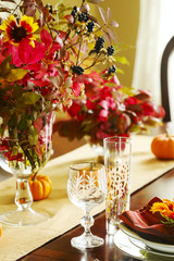 Thanksgiving table setting. Autumn table setting with small pumpkins