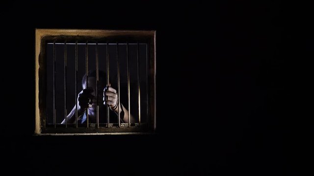 lonely sad african migrant in jail. Migration,human rights,illegality