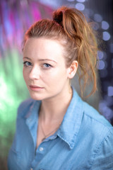 Fototapeta premium Portrait of white skin ginger girl with blue eyes with denim shirt