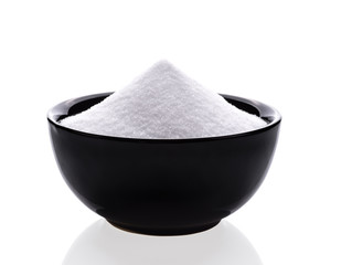 Bowl of sugar isolated on white background