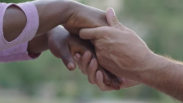 White man and black woman hands holding. Love, multiethnic,interracial