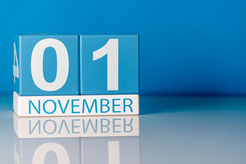 November 1st. Image of november 1 calendar on blue background. Empty space for text