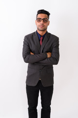 Obraz na płótnie Canvas Young Indian businessman wearing suit against white background