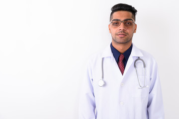 Young Indian man doctor wearing eyeglasses against white backgro