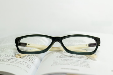 reading glasses on the book