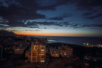 night city near the sea and mountains