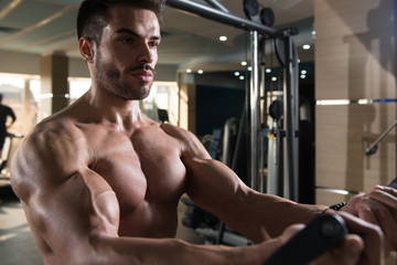 Bodybuilder Exercising Chest On Machine