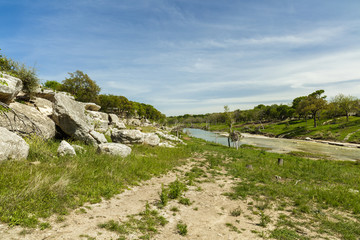 Fototapeta na wymiar The Blanco River and the natural beauty of the Texas Hill Country in the small town of Wimberley.